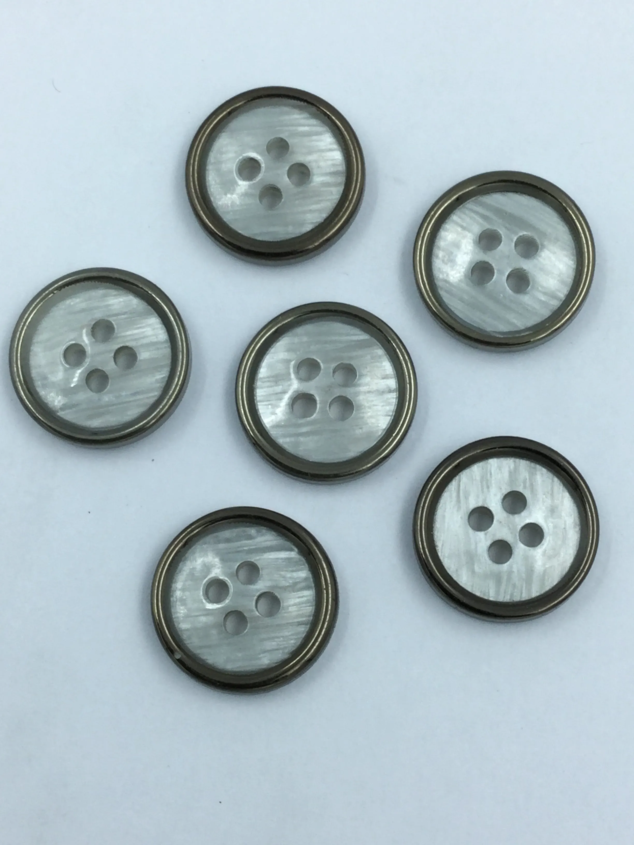 White Circular Plastic Shirt Buttons